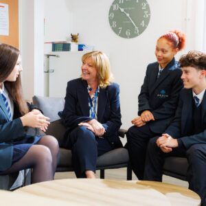 Headteacher Shirley Drummond talking with students